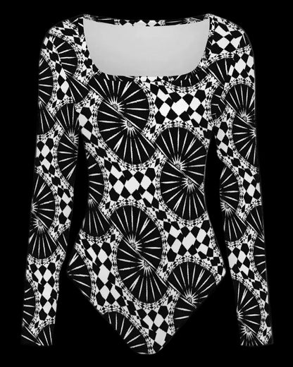 A long-sleeve bodysuit with a bold black and white geometric pattern featuring fan-like and diamond motifs, displayed on a solid white background.