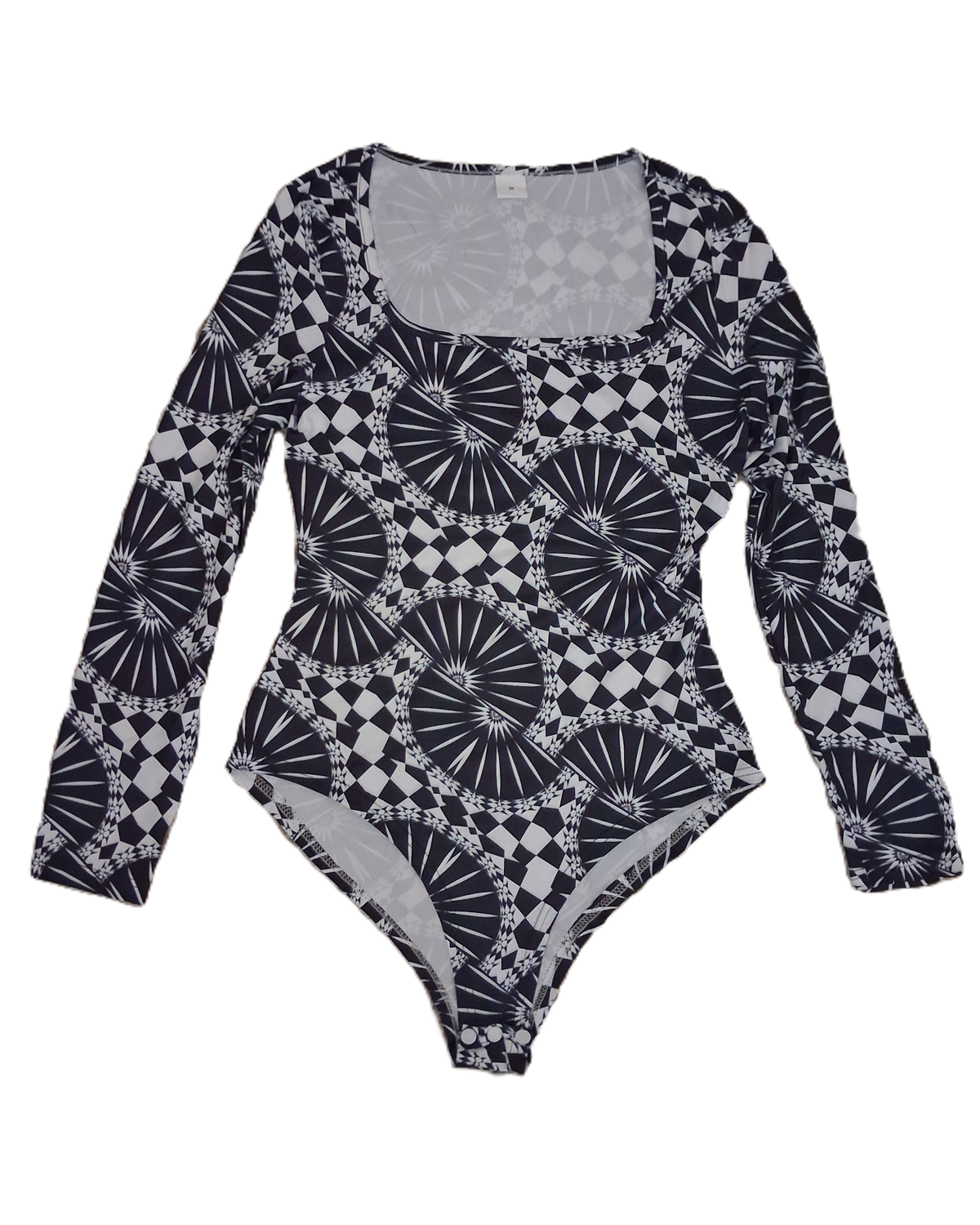 A long-sleeve bodysuit with a black and white geometric pattern featuring fan-like and checkerboard motifs, laid flat against a white background.